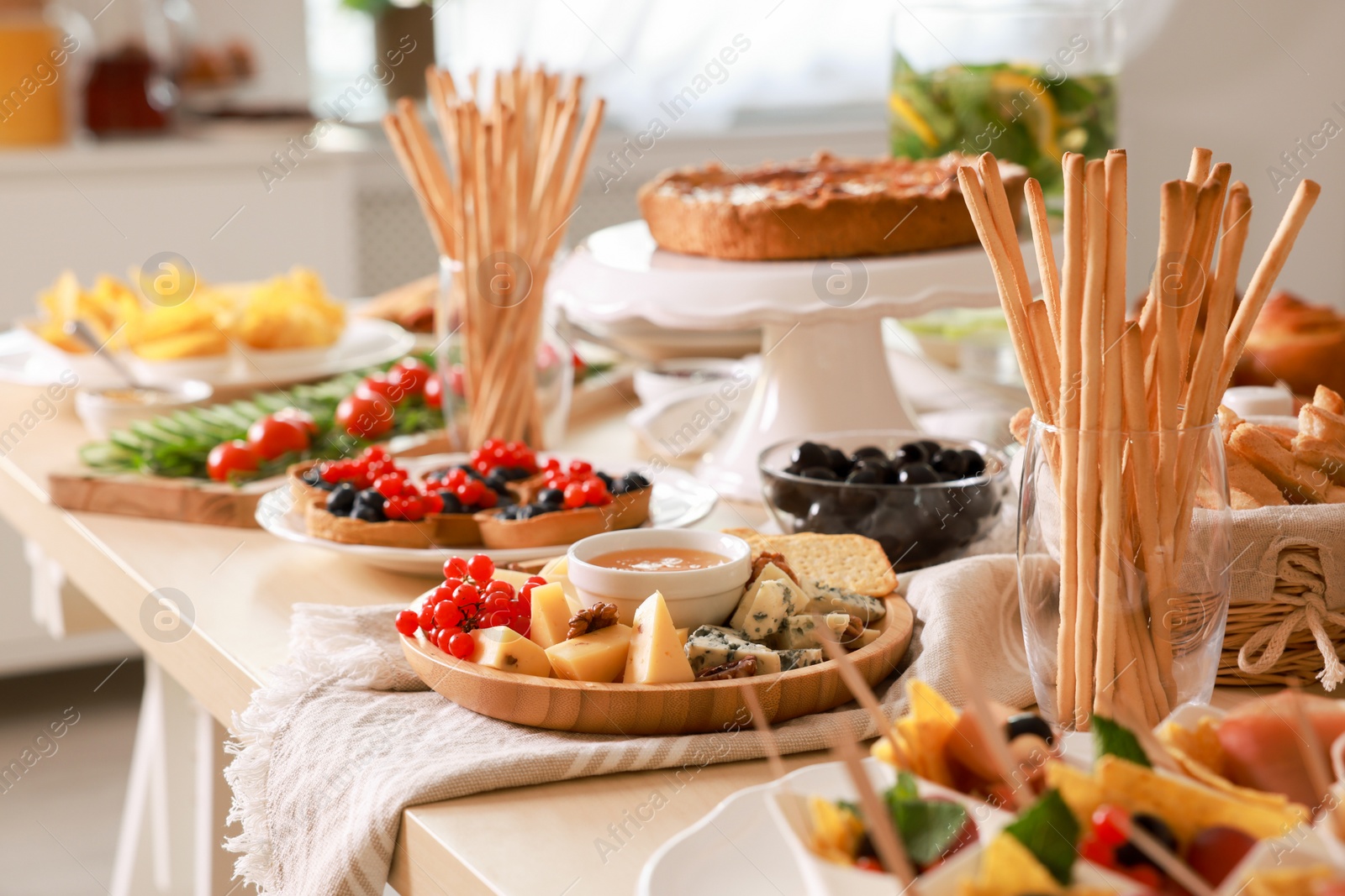 Photo of Dishes with different food on table in room. Luxury brunch