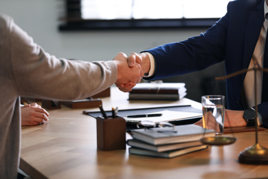 Photo of Male lawyer working with clients in office, closeup