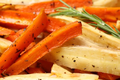 Photo of Tasty baked parsnip and bell pepper as background, closeup