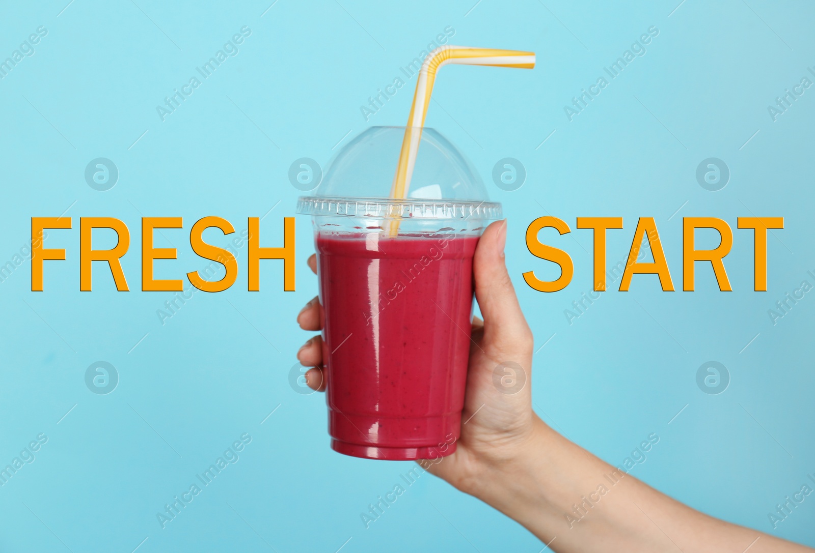 Image of Woman holding plastic cup with smoothie and phrase FRESH START on light blue background, closeup