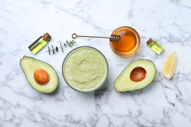 Photo of Homemade hair mask in bowl and ingredients on white marble table, flat lay