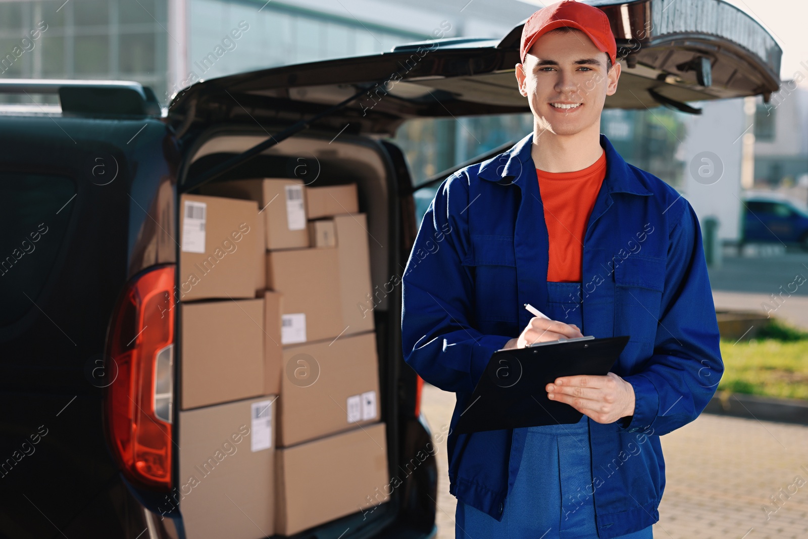 Photo of Courier with clipboard near delivery van outdoors, space for text