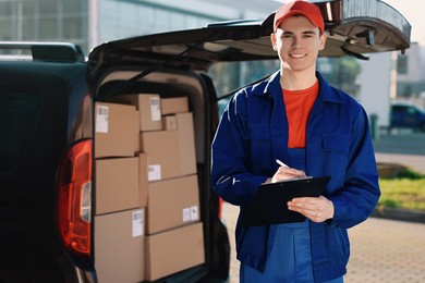 Courier with clipboard near delivery van outdoors, space for text