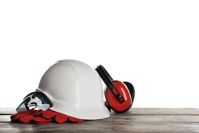 Photo of Set of safety equipment on table against white background