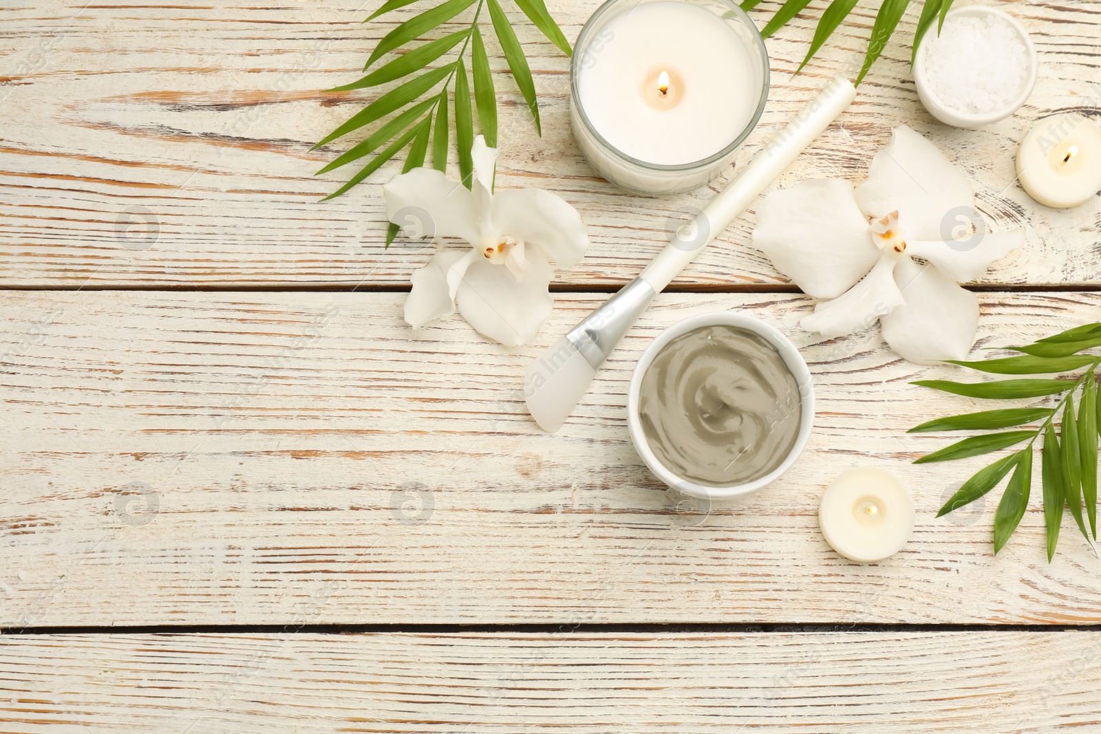 Photo of Flat lay composition with cosmetic product on white wooden background, space for text. Spa body wraps