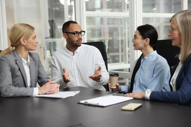 Lawyers working together at table in office