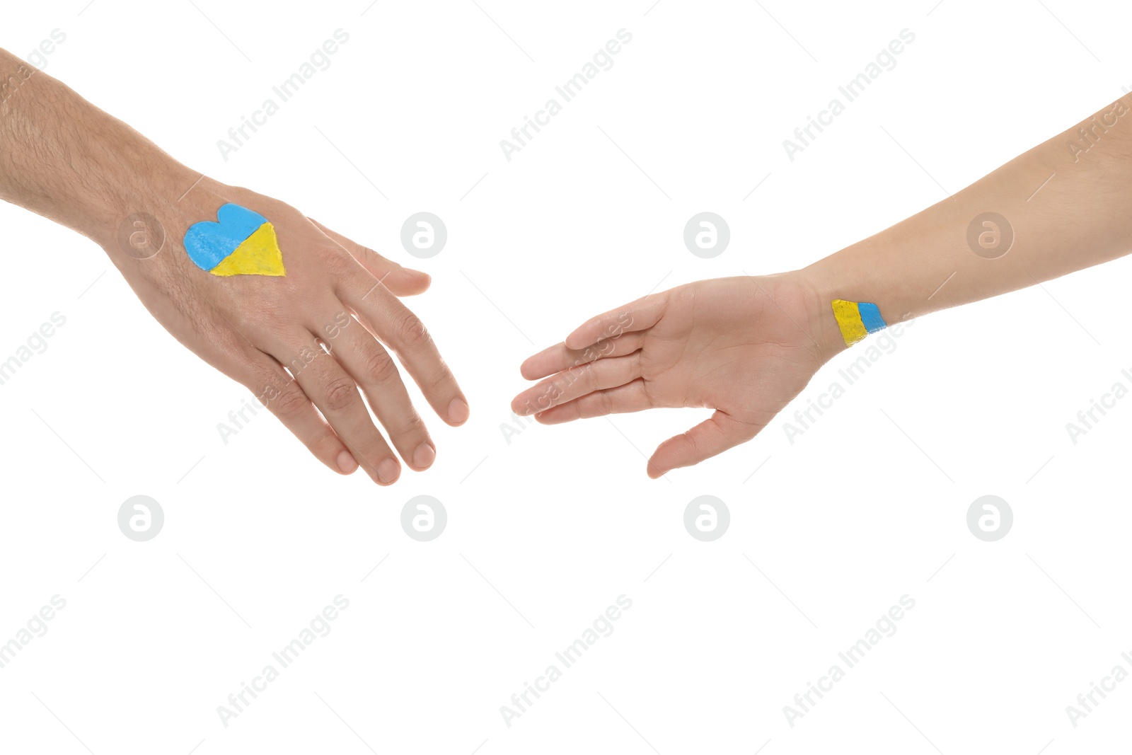 Photo of Man and woman with painted Ukrainian flags on their hands against white background, closeup