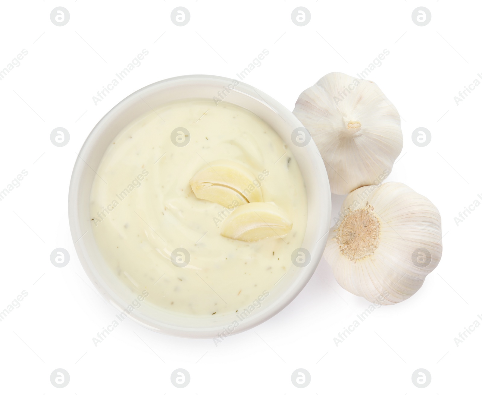 Photo of Bowl of homemade sauce and garlic isolated on white, top view