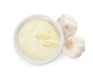 Photo of Bowl of homemade sauce and garlic isolated on white, top view