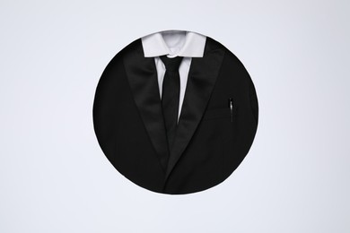 Creative business lunch layout. Hole with suit on white background, top view
