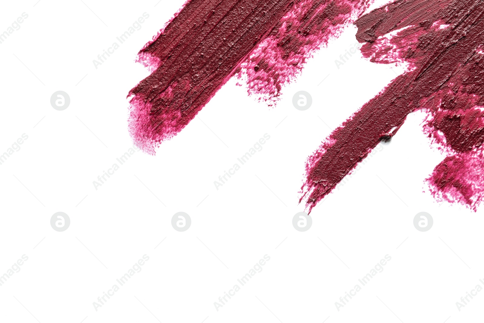 Photo of Lipstick smears on white background, top view. Space for text