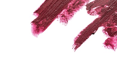 Photo of Lipstick smears on white background, top view. Space for text