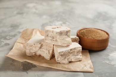 Photo of Compressed and granulated yeast on grey table