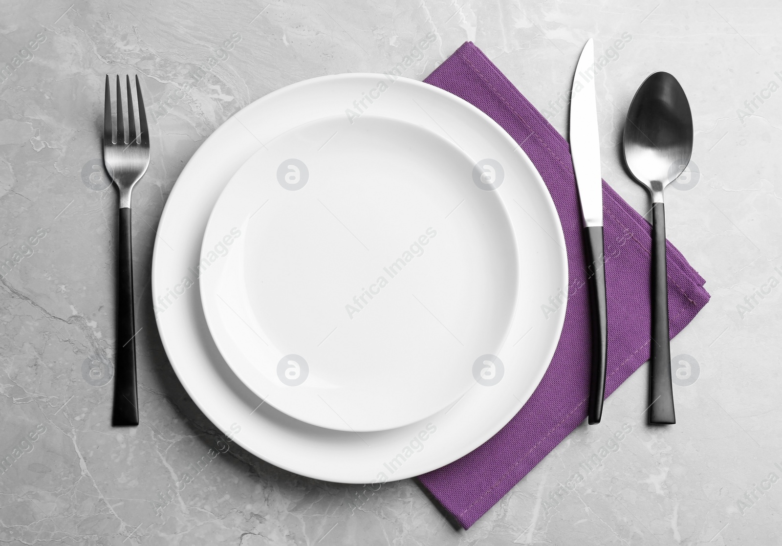 Photo of Elegant table setting on grey marble background, flat lay