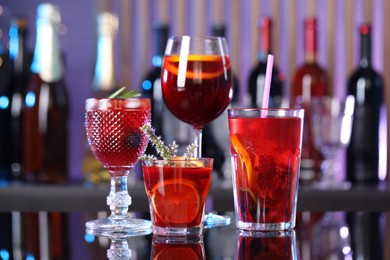 Many glasses of delicious refreshing sangria on counter in bar