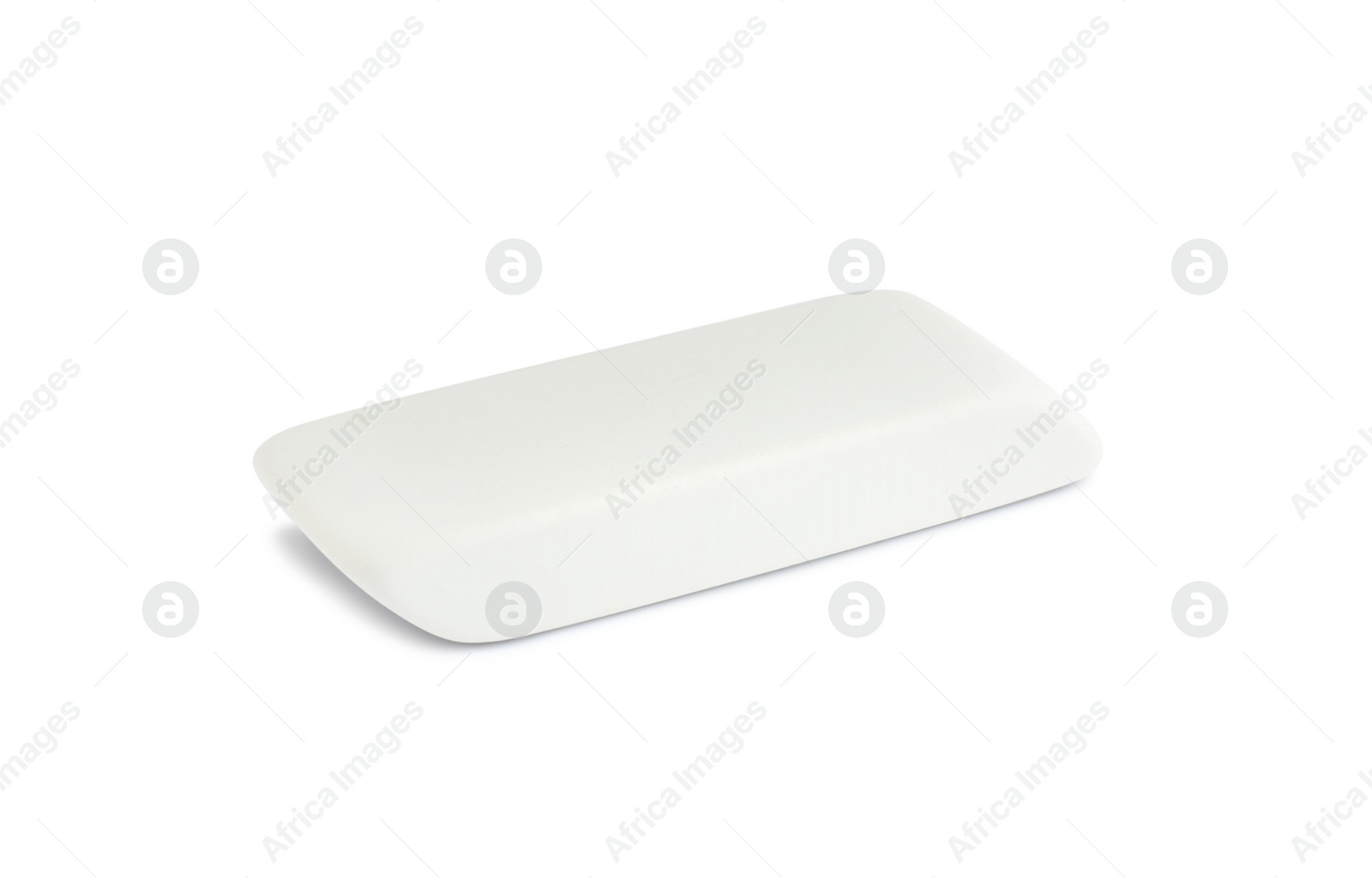 Photo of New eraser isolated on white. School stationery