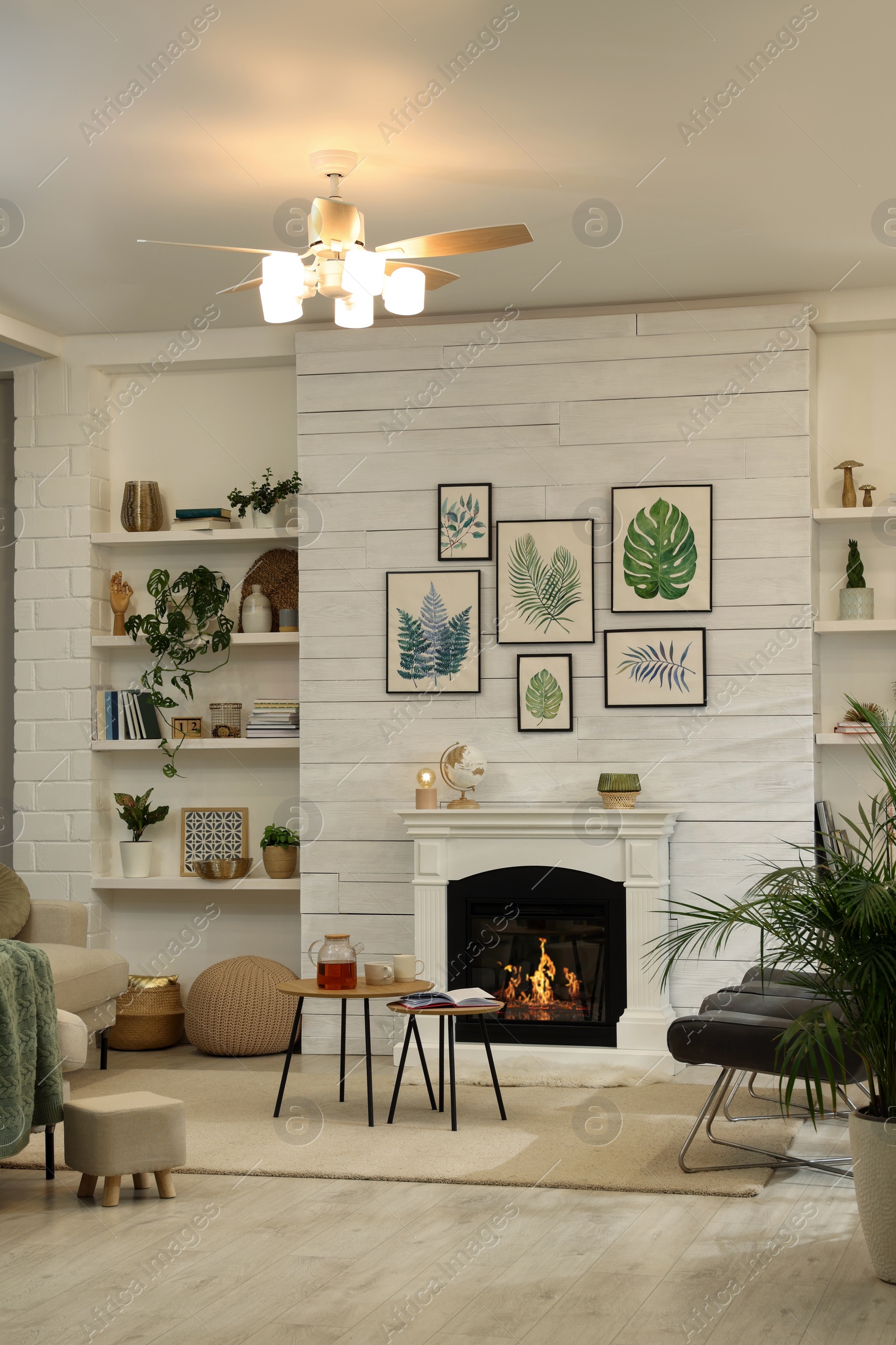 Photo of Stylish living room interior with comfortable chairs and decorative fireplace