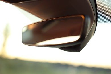 Photo of Clean rear view mirror in car, closeup