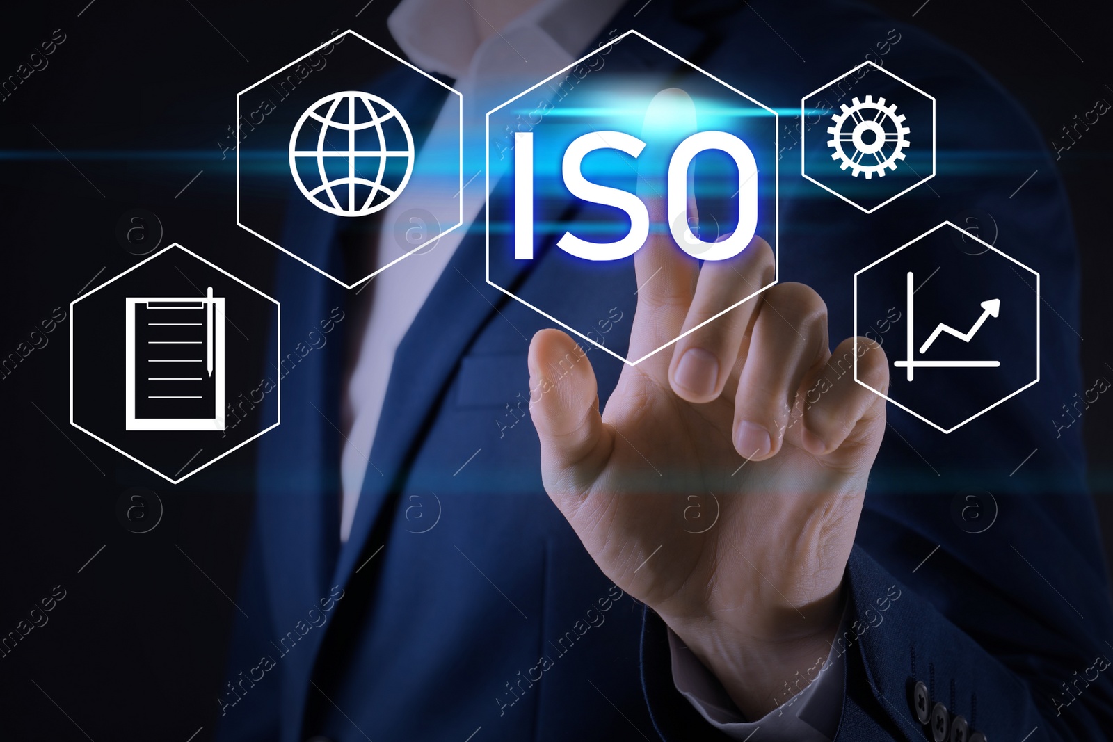 Image of Businessman pointing at virtual icon with text ISO on dark background, closeup 