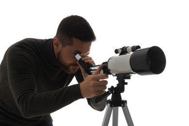 Astronomer looking at stars through telescope on white background