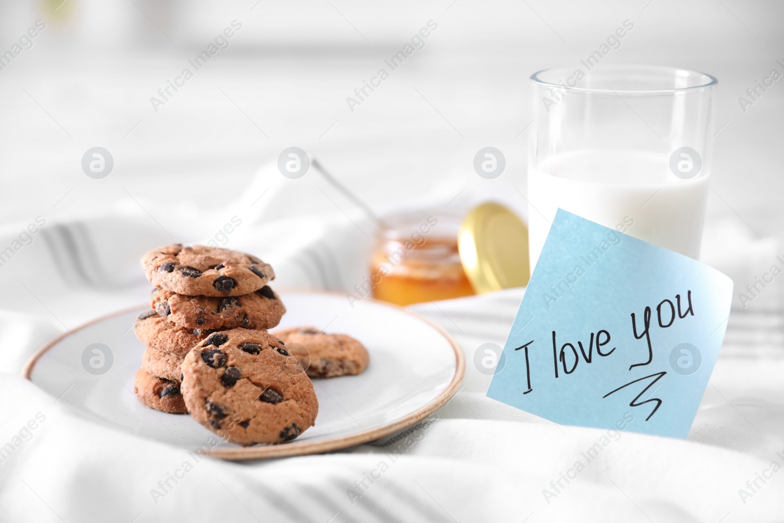 Photo of Romantic breakfast with note saying I Love You on table