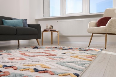 Living room with beautiful carpet and furniture, low angle view