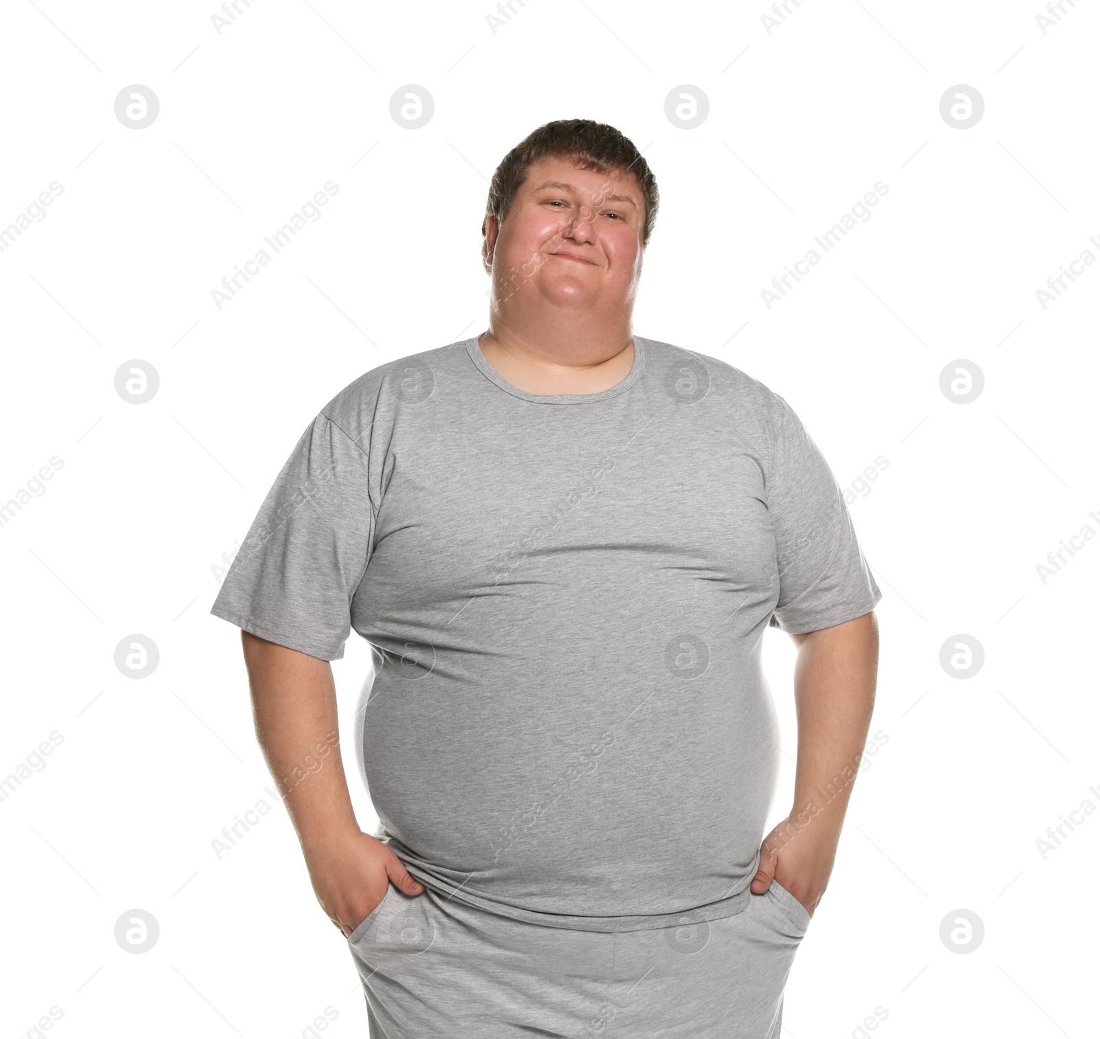 Photo of Portrait of overweight man posing on white background