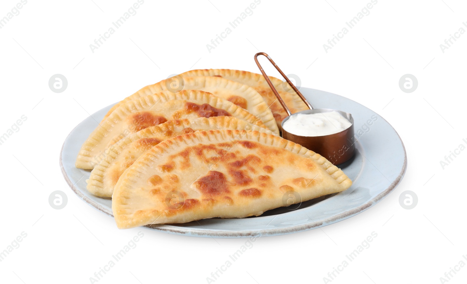 Photo of Delicious fried chebureki with cheese and sauce isolated on white