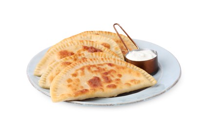 Photo of Delicious fried chebureki with cheese and sauce isolated on white