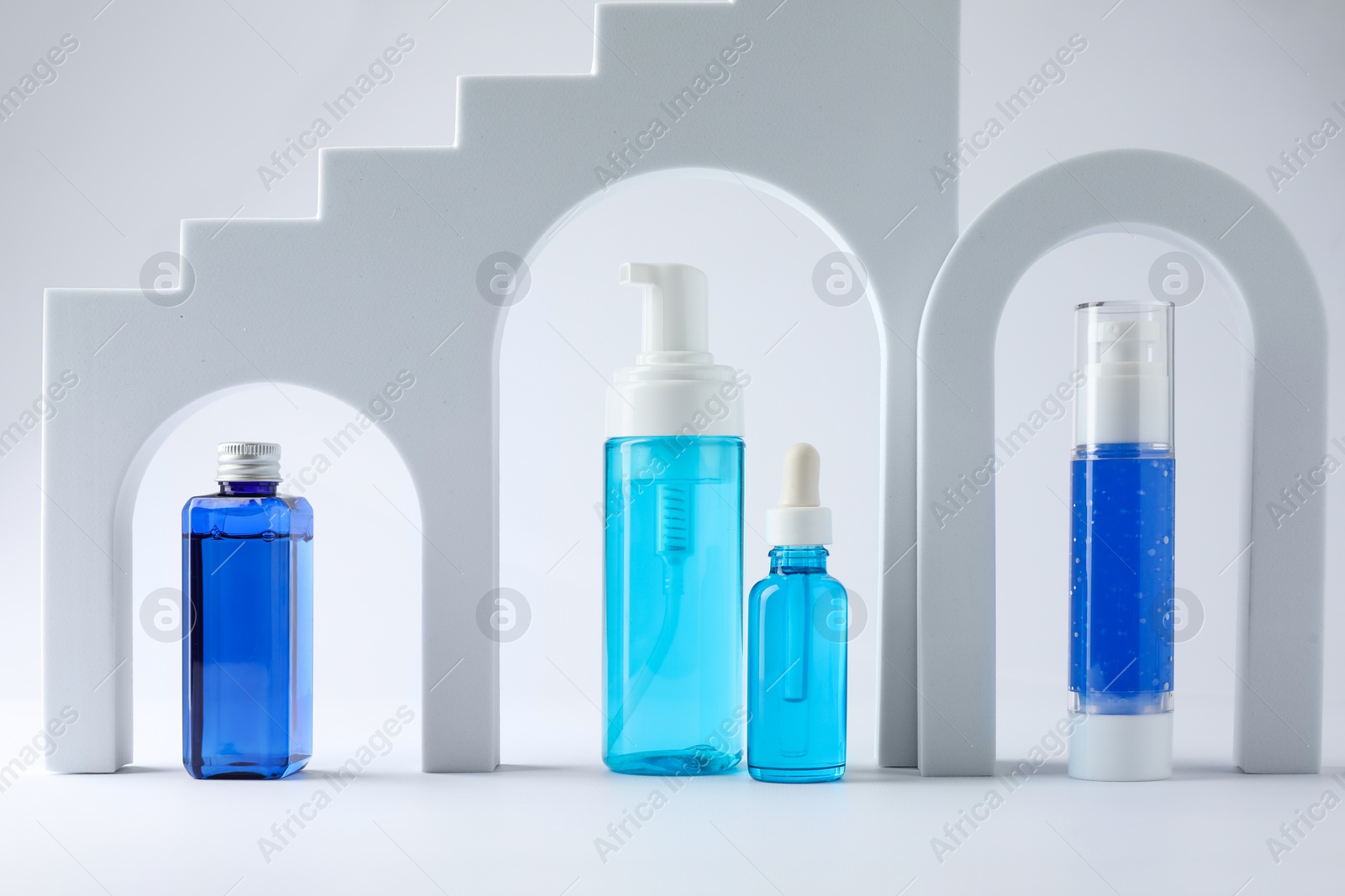 Photo of Stylish presentation of luxury cosmetic products on white background