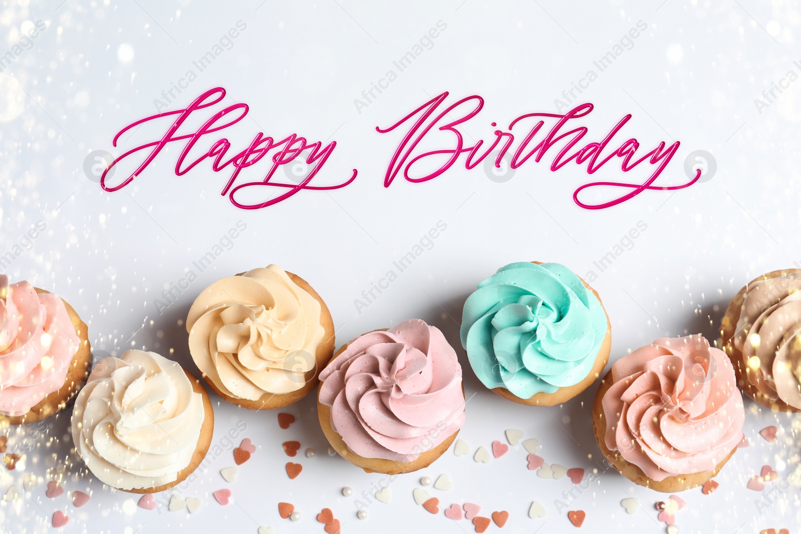 Image of Happy Birthday. Flat lay composition with tasty cupcakes on white background