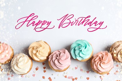 Happy Birthday. Flat lay composition with tasty cupcakes on white background