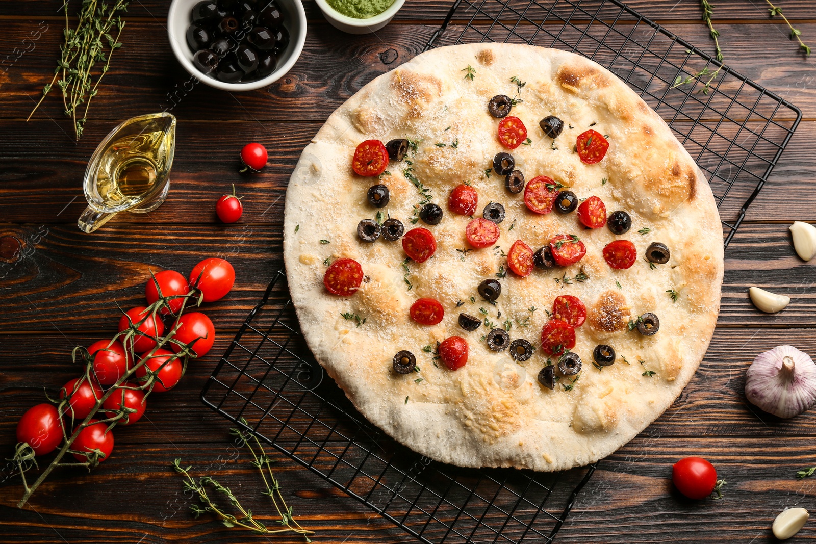 Photo of Flat lay composition with focaccia bread on wooden table