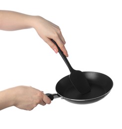 Photo of Woman with spatula and frying pan on white background, closeup