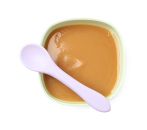 Photo of Tasty baby food in bowl and spoon isolated on white, top view