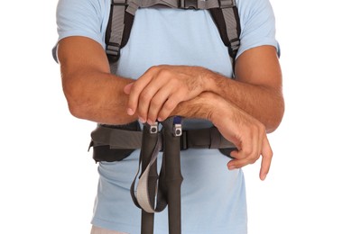 Male hiker with backpack and trekking poles on white background, closeup
