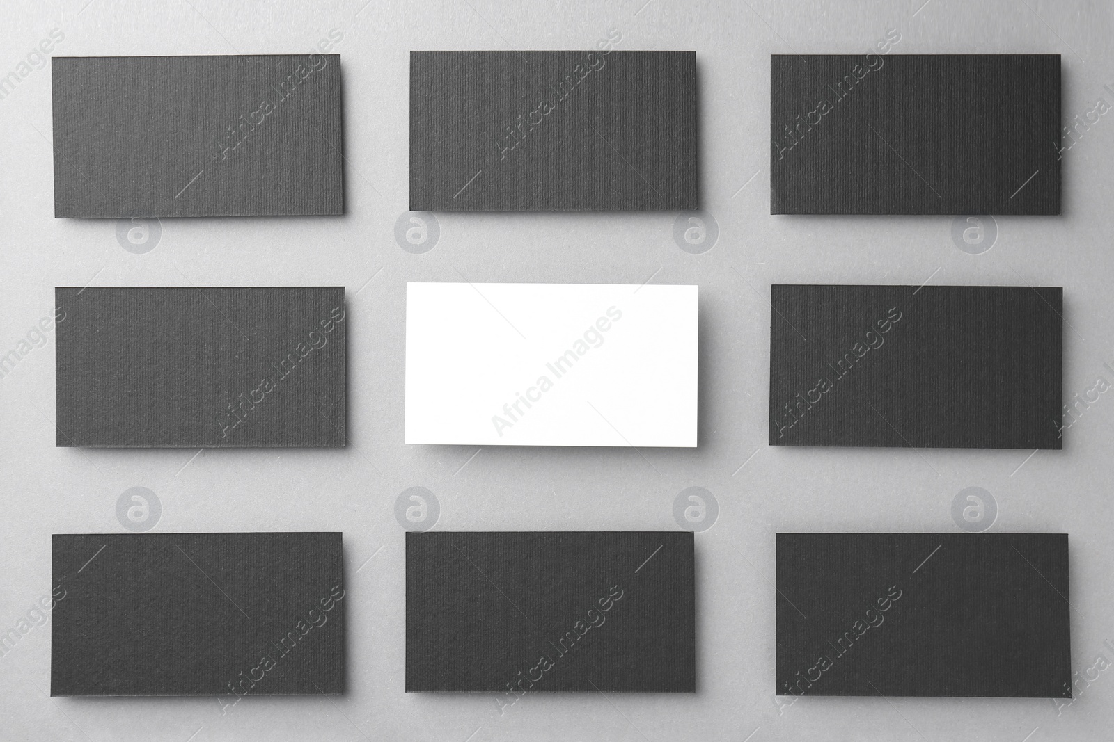 Photo of Blank business cards on light grey background, flat lay. Mockup for design