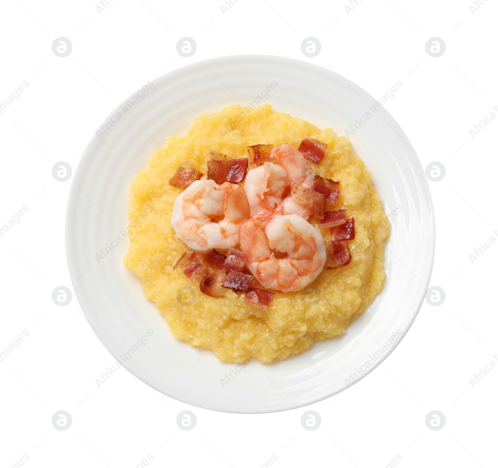 Photo of Plate with fresh tasty shrimps, bacon and grits isolated on white, top view