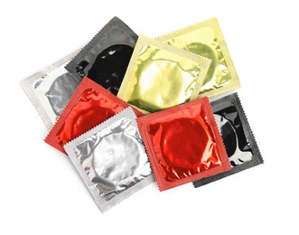 Photo of Condom packages on white background, top view. Safe sex