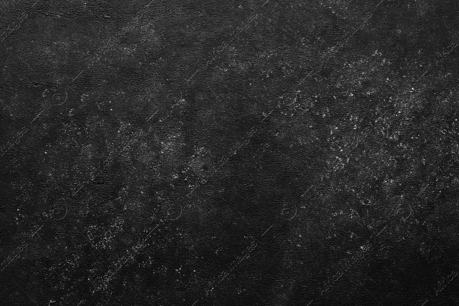 Photo of Black textured surface as background, top view