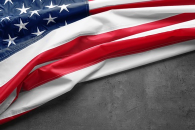 Photo of American flag on grey background, space for text