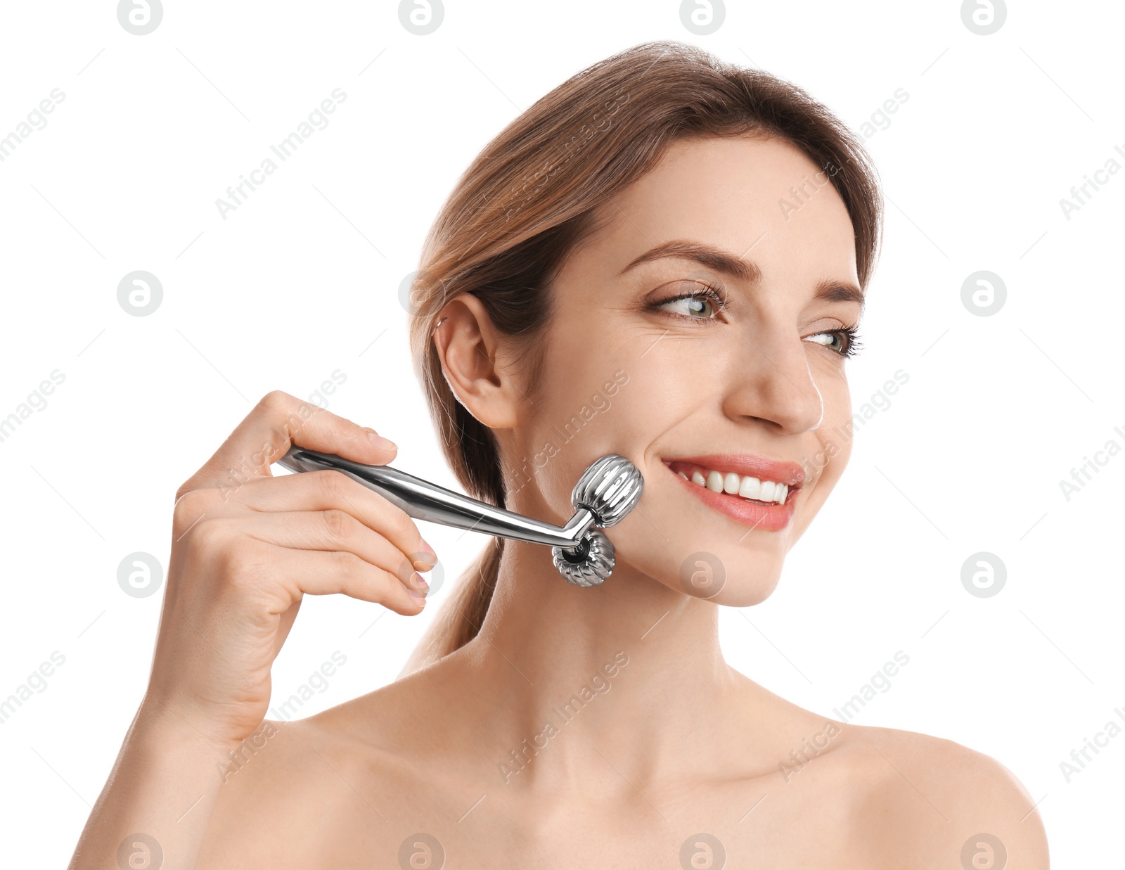 Photo of Young woman using metal face roller on white background