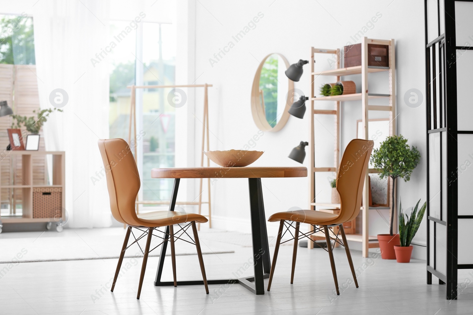 Photo of Modern dining room interior with table and chairs