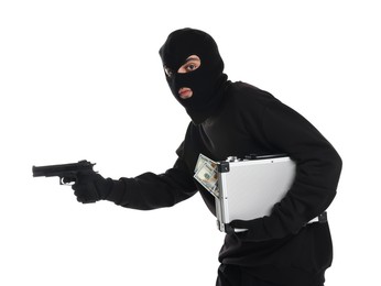 Thief in balaclava with gun and briefcase of money on white background