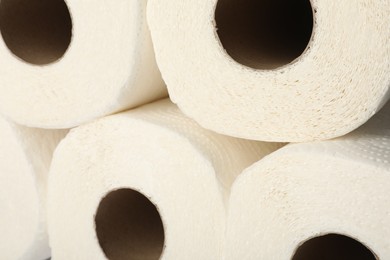 Rolls of paper towels as background, closeup view