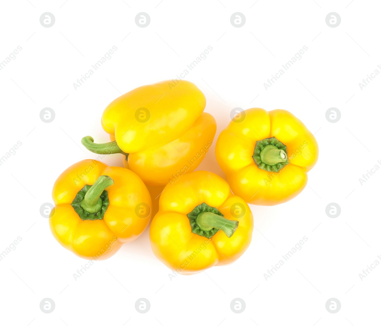 Photo of Ripe yellow bell peppers isolated on white, top view