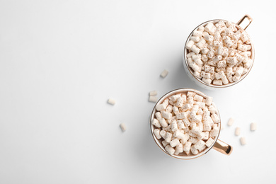 Photo of Delicious cocoa drink with marshmallows on white background, top view