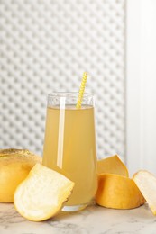 Photo of Freshly made turnip juice on white marble table