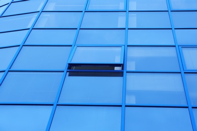 Photo of Modern office building with tinted windows. Urban architecture