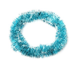 Photo of Shiny light blue tinsel isolated on white, top view
